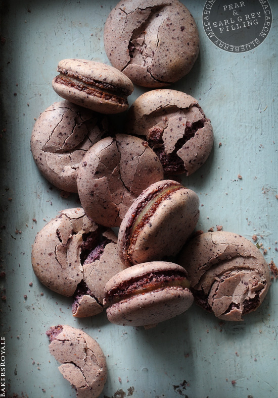 Nine Blueberry Macarons with Pear & Earl Grey Filling mostly smashed up to show the texture difference between crispy exterior and chewy interior. 