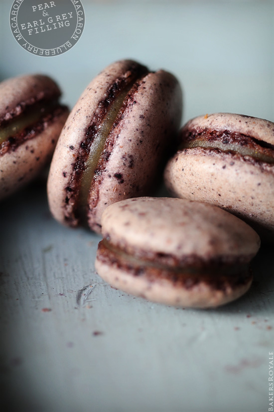 Close up shot of four Blueberry Macarons with Pear & Earl Grey Filling.