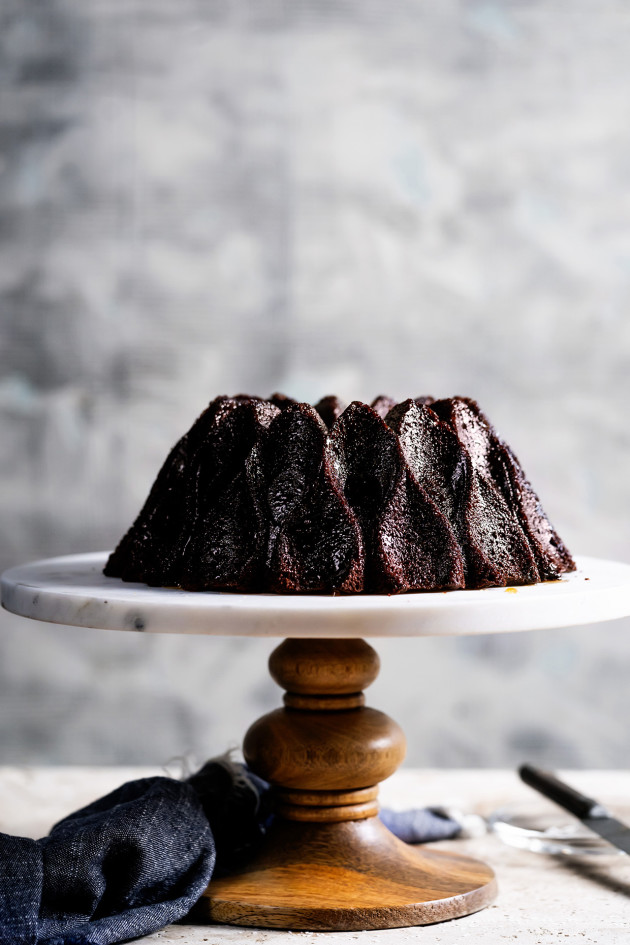 Chocolate Rum Cake on a cake stand.