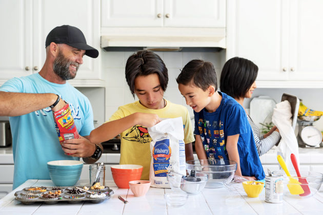 Matt and Naomi baking cookies with the kids.